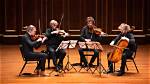 By a String Quartet?