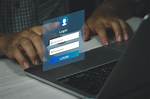 Person Logging into a Computer