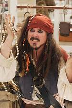 Pirate Captain Jack Swallows (Darrell Hammond) Is Surrounded by a Bevy of Beauties. Photo Credit: John P. Johnson