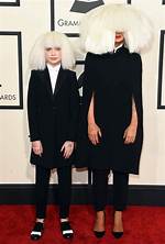 Sia, 41, Flops out Entire Boob as Robe Parts at Chest