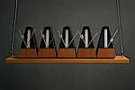 Why Do Metronomes Synchronize?